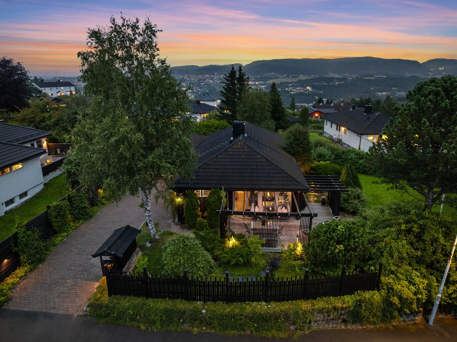 Detached house at Byåsen at dusk, overlooking Trondheim